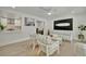 Inviting living room with stylish furniture and decor, connecting to a modern kitchen at 8419 Sylvan Woods Dr, Sarasota, FL 34243