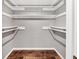 Walk in closet with shelving and vinyl flooring at 8470 Magnolia Dr, Seminole, FL 33777
