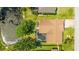 Aerial view of the home with a screened-in pool and a view of the lake at 914 82Nd Nw St, Bradenton, FL 34209