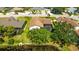 Aerial view of the home with a screened-in pool, trees, and a pond at 914 82Nd Nw St, Bradenton, FL 34209