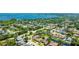 Stunning aerial view of a single-Gathering home in a lush community near the water, boasting a backyard pond at 914 82Nd Nw St, Bradenton, FL 34209