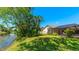 The backyard borders a pond and has a screened-in pool at 914 82Nd Nw St, Bradenton, FL 34209