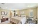 Relaxing bedroom featuring an ensuite bathroom and warm, neutral decor at 914 82Nd Nw St, Bradenton, FL 34209