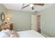 Bedroom with natural lighting featuring a ceiling fan and access to ensuite at 914 82Nd Nw St, Bradenton, FL 34209