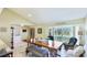 This spacious dining area features a large wooden table with seating and a view of the backyard at 914 82Nd Nw St, Bradenton, FL 34209
