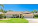 Charming single-Gathering home featuring a well-manicured lawn, attached garage, and vibrant landscaping at 914 82Nd Nw St, Bradenton, FL 34209
