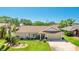 Charming single-Gathering home featuring a well-manicured lawn, attached garage, and vibrant landscaping at 914 82Nd Nw St, Bradenton, FL 34209