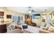 Open-concept living area with sliding doors to the pool and cozy seating at 914 82Nd Nw St, Bradenton, FL 34209