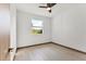 Bright, neutral bedroom with wood trim flooring and ceiling fan at 102 Arrow Ln, Rotonda West, FL 33947