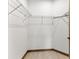 Walk-in closet featuring wire shelving and tile floors at 102 Arrow Ln, Rotonda West, FL 33947
