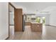 Open concept kitchen with island, stainless steel appliances, and access to living area at 102 Arrow Ln, Rotonda West, FL 33947