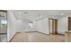 Bright, empty living room with hardwood floors, recessed lighting, and natural light at 102 Arrow Ln, Rotonda West, FL 33947