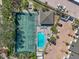 Aerial view of pool, tennis courts, clubhouse, and parking area for residents at 1233 Dockside Pl # 207, Sarasota, FL 34242