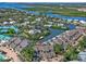 Stunning aerial view of waterfront homes with boat docks nestled among lush greenery and waterways at 1233 Dockside Pl # 207, Sarasota, FL 34242
