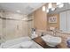 Stylish bathroom features a vessel sink, neutral tile, and a glass enclosed shower at 1233 Dockside Pl # 207, Sarasota, FL 34242