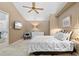Comfortable bedroom featuring a ceiling fan, side tables and bright natural light at 1233 Dockside Pl # 207, Sarasota, FL 34242