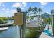 View of a boat on a lift next to a dock at 1233 Dockside Pl # 207, Sarasota, FL 34242