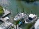 View of a boat dock, boat lift and water at 1233 Dockside Pl # 207, Sarasota, FL 34242