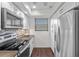 Well-lit kitchen featuring modern appliances, ample counter space, and sleek cabinetry at 1233 Dockside Pl # 207, Sarasota, FL 34242