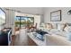 Comfortable living room with large windows leading to a screened-in porch at 1233 Dockside Pl # 207, Sarasota, FL 34242