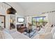 Inviting living room with access to the bedroom and screened-in porch at 1233 Dockside Pl # 207, Sarasota, FL 34242
