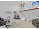 Bright office space with a ceiling fan and staircase access at 1233 Dockside Pl # 207, Sarasota, FL 34242