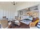Screened porch adjacent to living room, offering additional living space with spiral staircase access at 1233 Dockside Pl # 207, Sarasota, FL 34242