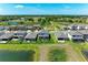 Aerial view of several houses, revealing a beautiful community with ponds and manicured lawns at 12664 Oak Hill Way, Parrish, FL 34219