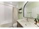 Well-lit bathroom featuring a shower-tub combo, quartz countertop sink, and modern fixtures at 12664 Oak Hill Way, Parrish, FL 34219