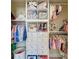 Organized walk-in closet with clothes and accessories and built-in storage solutions at 12664 Oak Hill Way, Parrish, FL 34219