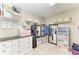 Walk-in closet with custom shelving and drawers for optimal storage solutions at 12664 Oak Hill Way, Parrish, FL 34219