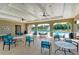 Clubhouse's gathering spot featuring ample seating with tables and chairs, overlooking the community pool at 12664 Oak Hill Way, Parrish, FL 34219