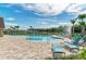 Inviting community pool and ample lounge chairs, offering a relaxing oasis with a fountain backdrop at 12664 Oak Hill Way, Parrish, FL 34219