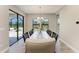 Dining room with a large window and sliding glass doors that provide lots of natural light at 12664 Oak Hill Way, Parrish, FL 34219