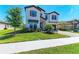 Charming two-story home with manicured lawn, stone accents, and a two-car garage at 12664 Oak Hill Way, Parrish, FL 34219