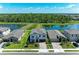 Beautiful two-story home with a well-manicured front lawn and water views, located in a desirable neighborhood at 12664 Oak Hill Way, Parrish, FL 34219