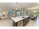 Spacious kitchen island with sink, open to the living and dining areas for easy entertaining at 12664 Oak Hill Way, Parrish, FL 34219