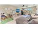 Cozy living room features a large sectional sofa and entertainment area for Gathering enjoyment at 12664 Oak Hill Way, Parrish, FL 34219