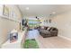 Expansive living room featuring a large sectional sofa and entertainment area for Gathering enjoyment at 12664 Oak Hill Way, Parrish, FL 34219