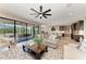 Open living area with sliding glass doors to the lanai and a view of the kitchen and dining area at 12664 Oak Hill Way, Parrish, FL 34219