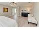 Bright and spacious main bedroom featuring a black dresser and a white bench at 12664 Oak Hill Way, Parrish, FL 34219