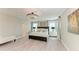 Beautiful main bedroom features a chandelier, windows and decorative lighting at 12664 Oak Hill Way, Parrish, FL 34219