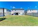 Expansive backyard featuring a well-maintained lawn and patio, ideal for outdoor activities and gatherings at 12738 Hysmith Loop, Parrish, FL 34219