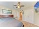 Bedroom featuring a ceiling fan, picture on the wall, and closet in a neutral colored room at 12738 Hysmith Loop, Parrish, FL 34219