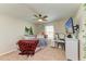 Inviting bedroom with a TV, a vanity, and a window that lets in plenty of natural light at 12738 Hysmith Loop, Parrish, FL 34219