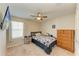 Comfortable bedroom with a ceiling fan and ample closet space at 12738 Hysmith Loop, Parrish, FL 34219