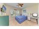 Bright bedroom with a ceiling fan, and ample light from the window at 12738 Hysmith Loop, Parrish, FL 34219