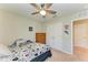 Cozy bedroom featuring a ceiling fan, closet and gamer theme at 12738 Hysmith Loop, Parrish, FL 34219