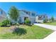 Well-manicured front yard and two-story home featuring blue and gray accents at 12738 Hysmith Loop, Parrish, FL 34219