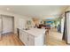 Bright, open kitchen boasts an island with quartz countertop and stainless steel appliances at 12738 Hysmith Loop, Parrish, FL 34219